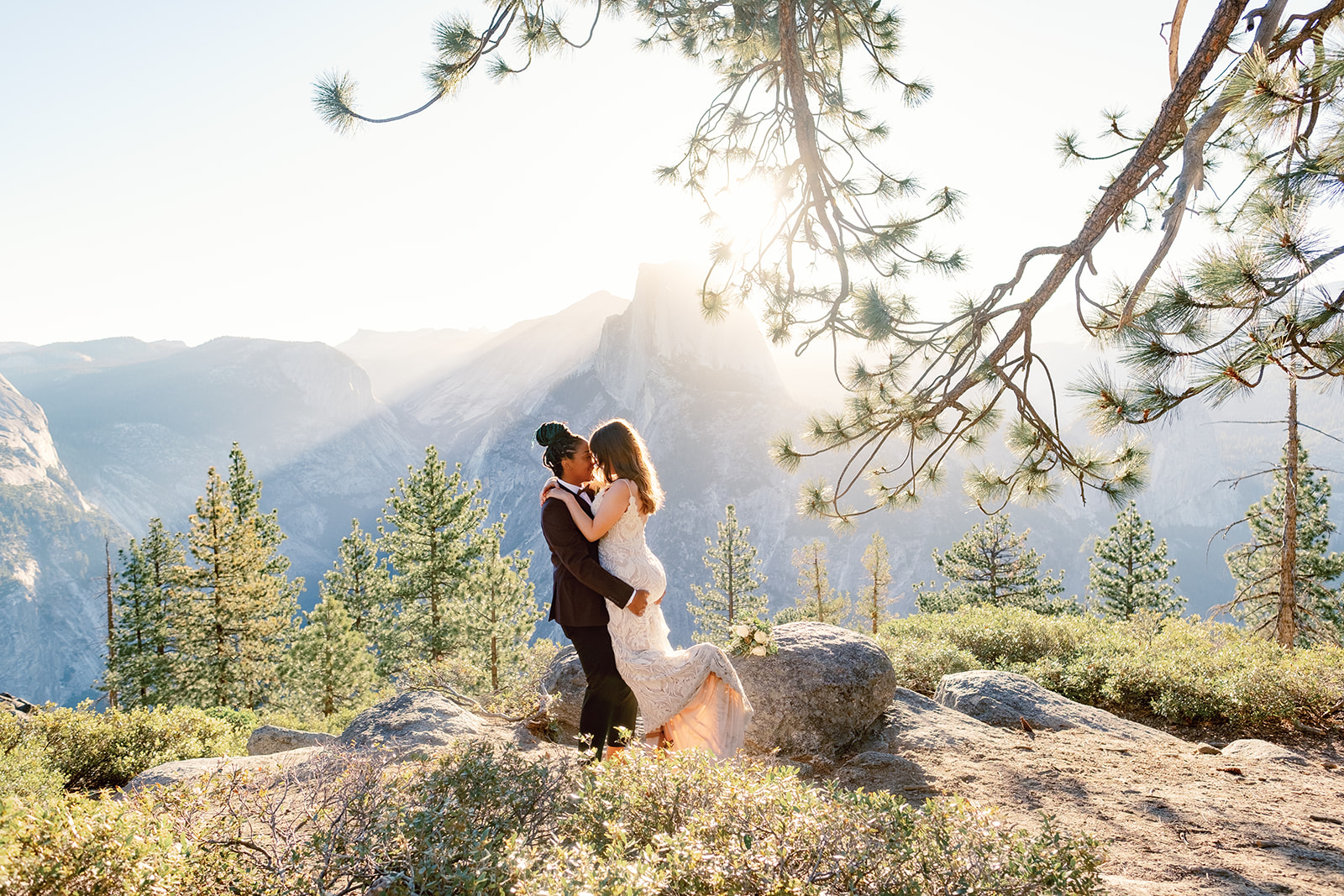 two women kissing at Glacier Point Yosemite