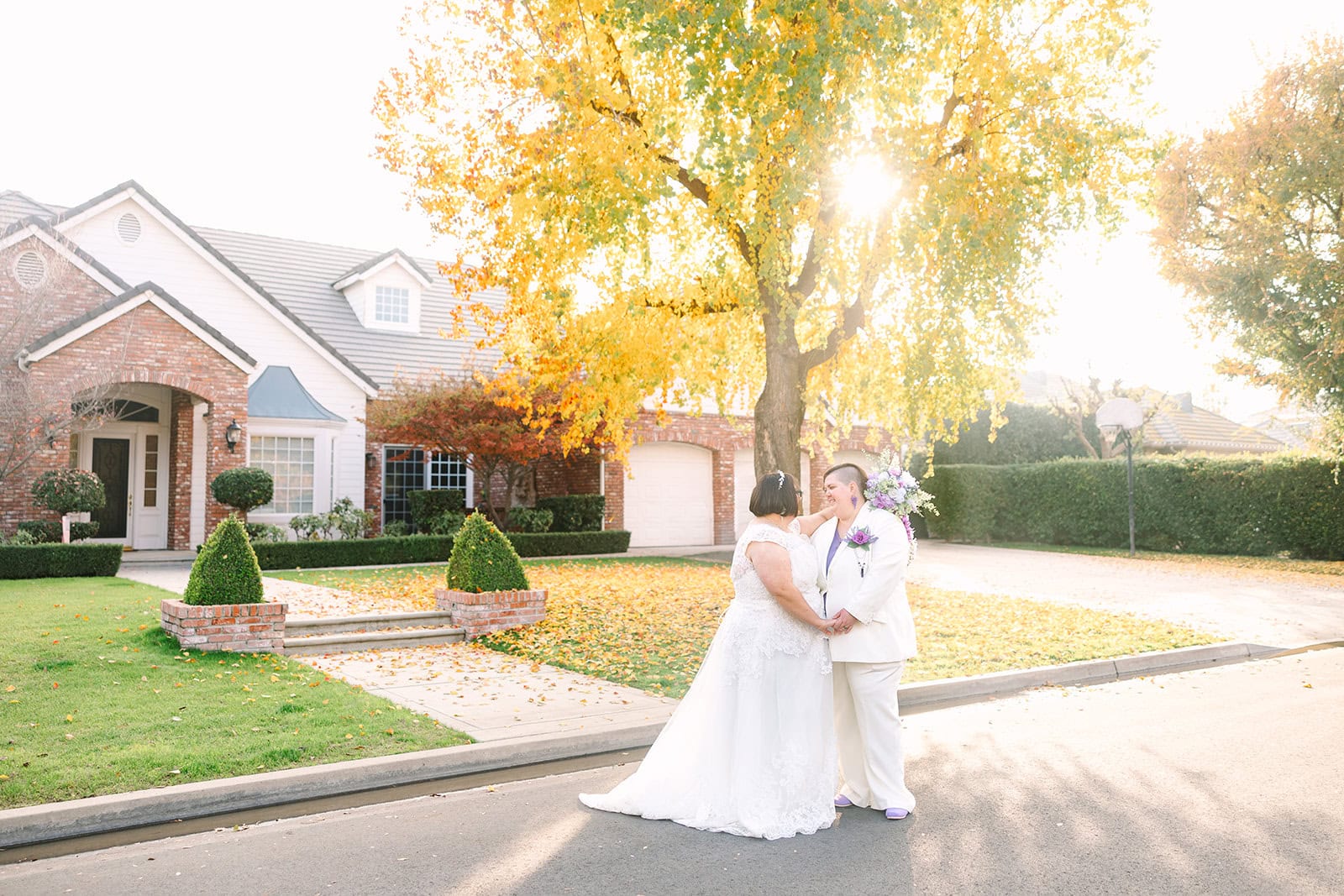 Two brides getting married in Fresno at their Backyard wedding captured by GunnShot Photography