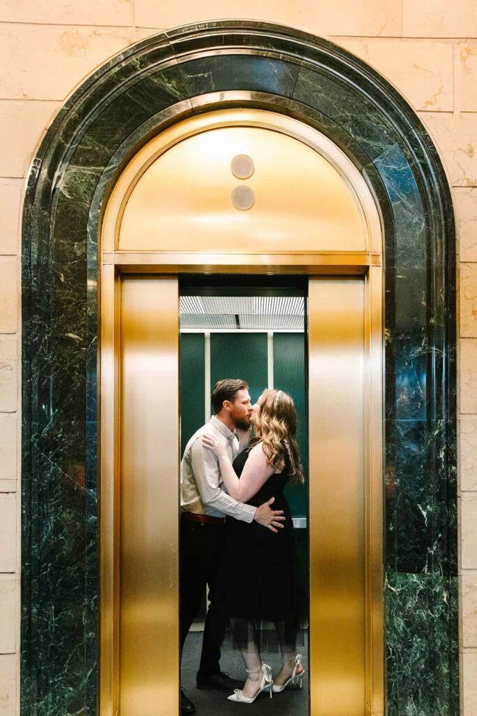 Courthouse wedding kiss in downtown Fresno elevator Couple sharing a kiss in a golden elevator during their courthouse wedding session in Fresno