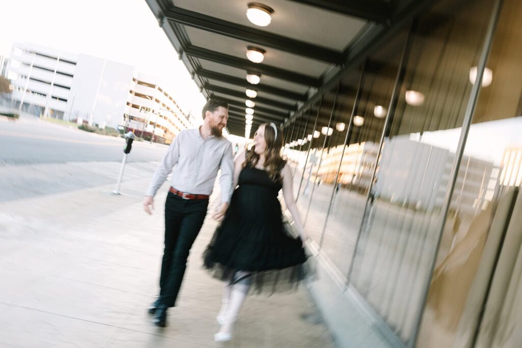 Courthouse wedding couple walking downtown Fresno Couple walking hand-in-hand with motion blur during a fun courthouse wedding session in Fresno