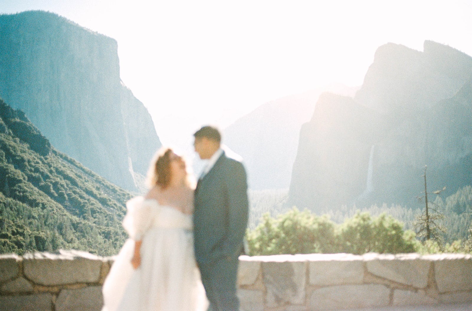 Sunrise elopement in Yosemite with warm golden light over the valley, captured by a Yosemite LGBTQ photographer