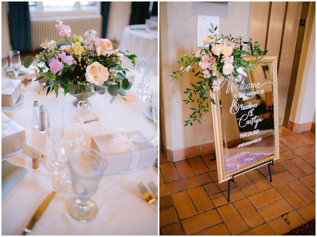 Soft pink and peach floral centerpiece on a reception table and a gold-framed welcome sign with greenery at a Berkley City Club wedding, captured by Michelle Gunn Photo for a joyful lesbian wedding celebration.