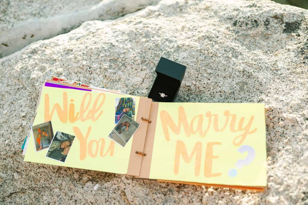 Lesbian couple proposal at Taft Point Yosemite at sunset