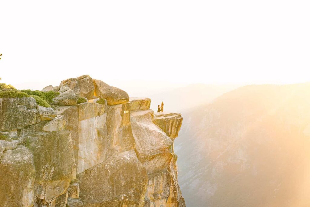 Lesbian couple proposal at Taft Point Yosemite at sunset